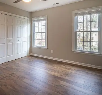 Bedroom finished in hardwood and laminate