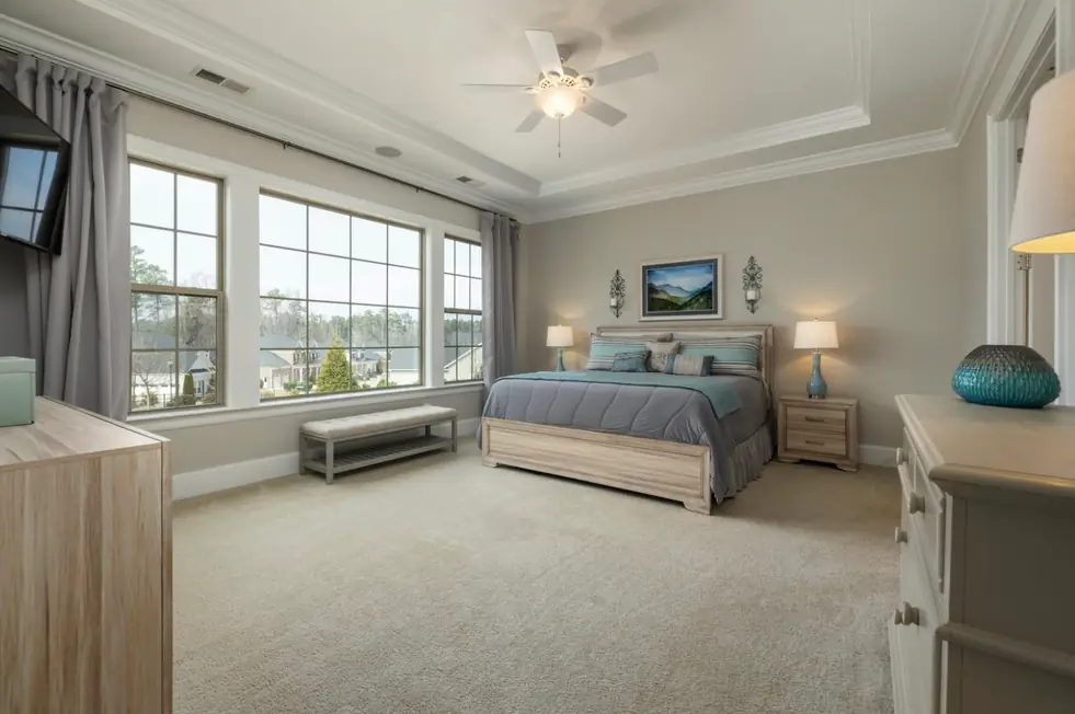 Primary bedroom in a Crystal Lake area home with new cream carpet laid wall to wall